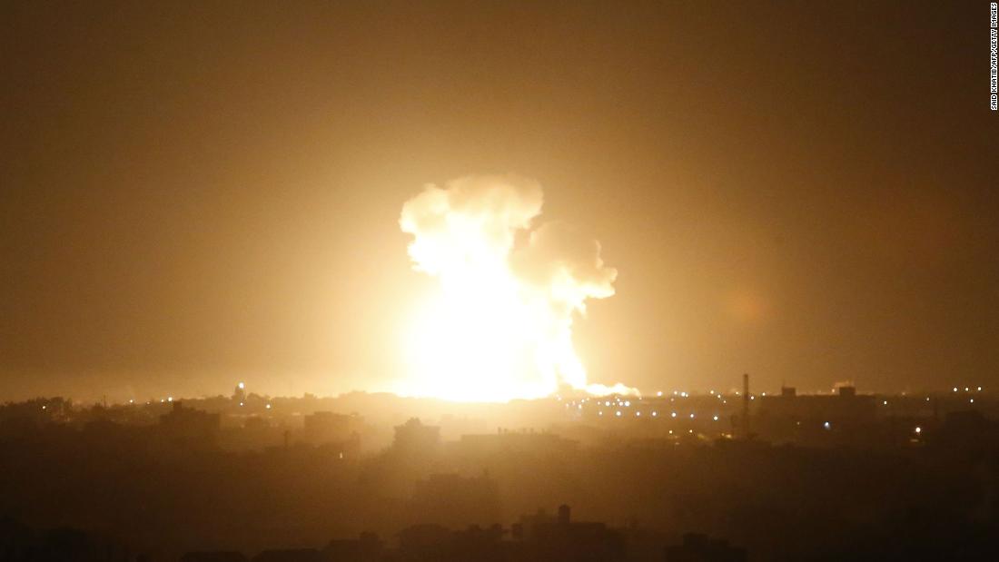 Israel and Palestinian militants exchange fire as graphic video of Israeli bulldozer carrying a body goes viral