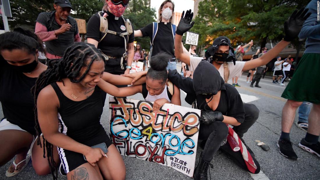 Grief and anger over George Floyd’s death spark protests demanding change in week since video went viral