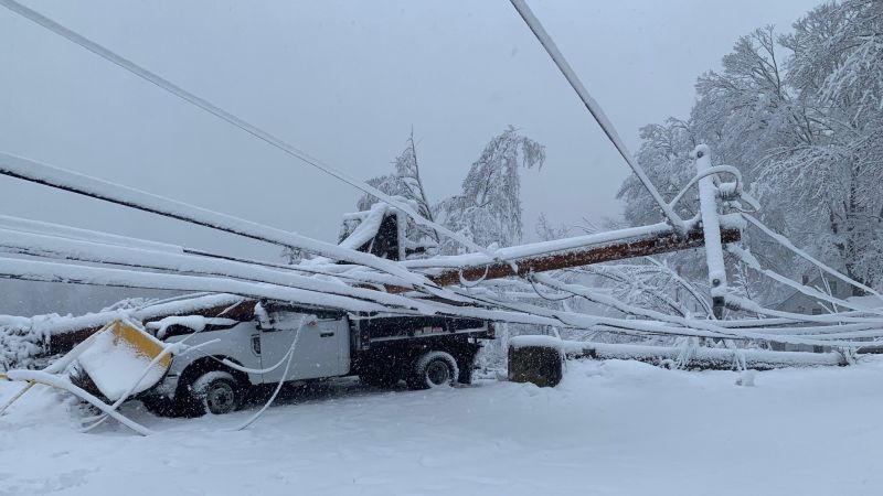 Nor’easter dumps heavy snow and cuts off power to hundreds of thousands across Northeast as many roads remain impassable